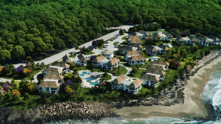 an aerial view of a resort by the ocean